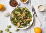 Quinoa Roasted Idaho® Potato & Caramelized Onion Bowl with Arugula & Tahini Lemon Dressing