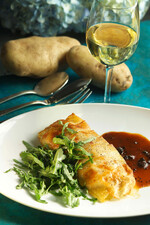 Idaho® Potato Crusted Black Bass with Black Truffle Sauce and Wild Arugula