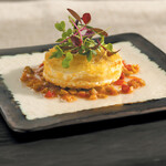 Warm Chèvre and Idaho® Potato Cake with Sun-dried Tomato and Olive Vinaigrette 